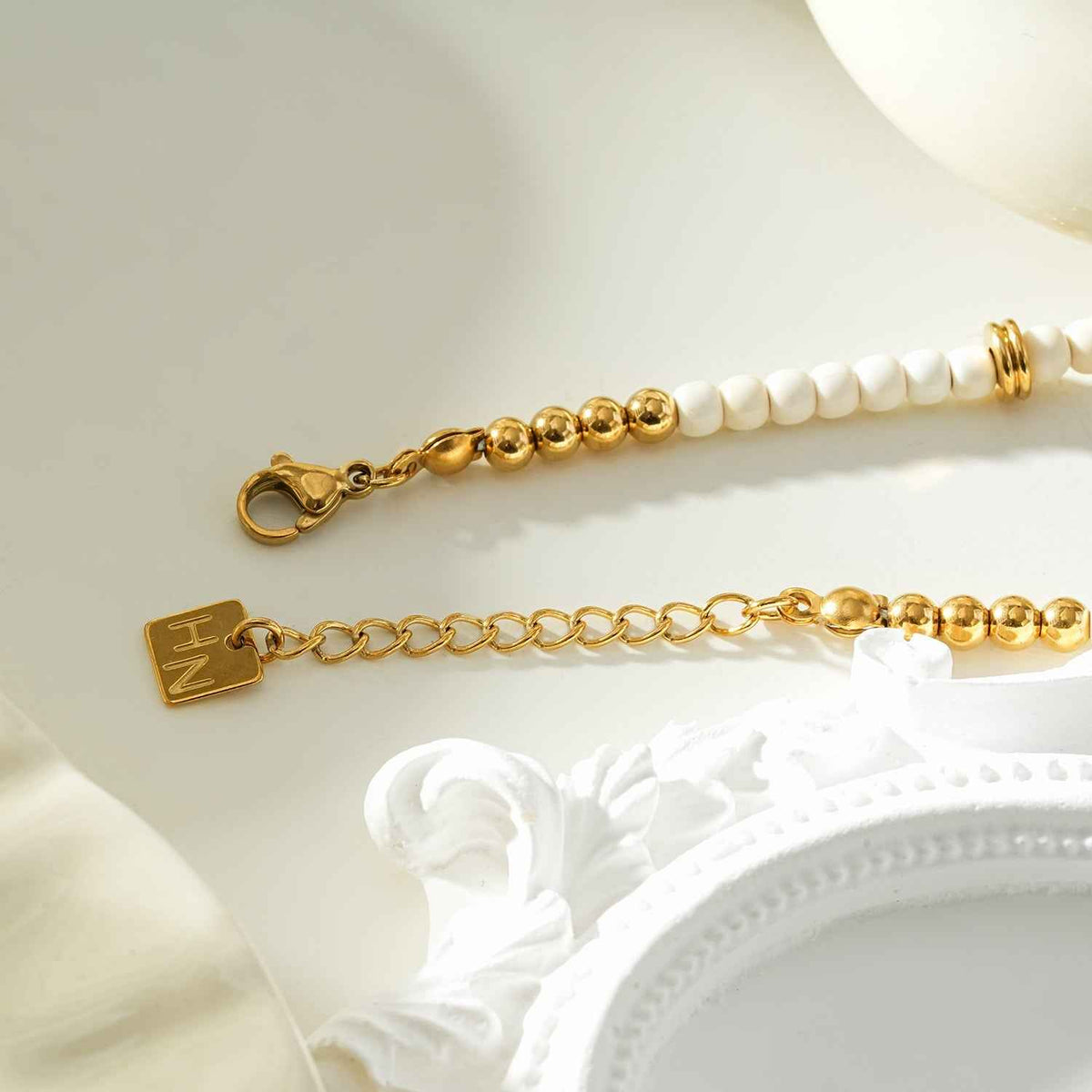 JAMILAH Gold: White Turquoise Stones and Gold Beaded Bracelet.