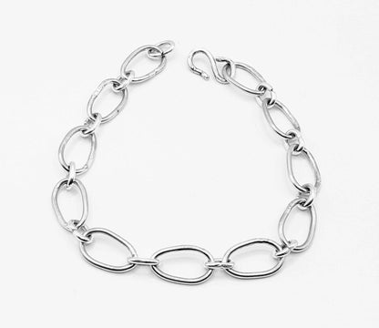 Radiant Linkage: Handcrafted Sterling Silver Oval Chain Bracelet